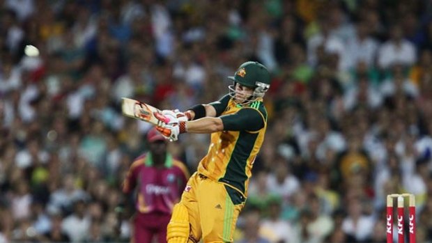 Smack . . . David Warner lashes one of seven sixes in his blistering innings of 67 off 29 balls last night.