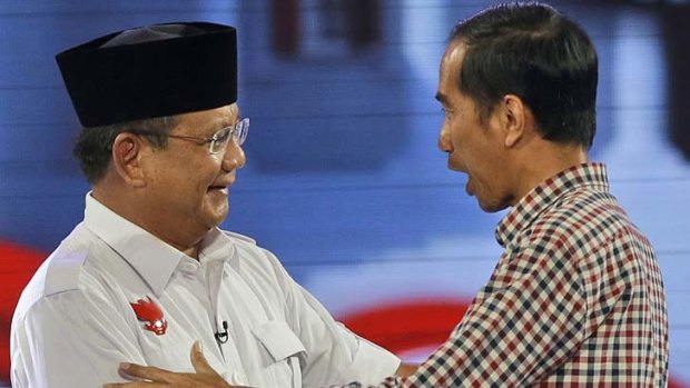 Indonesian election: Joko Widodo, right, shakes hands with his opponent Prabowo Subianto.