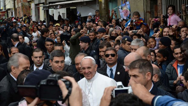 Pope Francis walks around the Varginha favela in Rio de Janeiro, a community of 1000 people which for decades was under the sway of narco-traffickers.