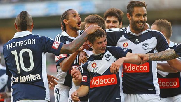 On target: Marco Rojas celebrates with teammates after scoring against the Jets.