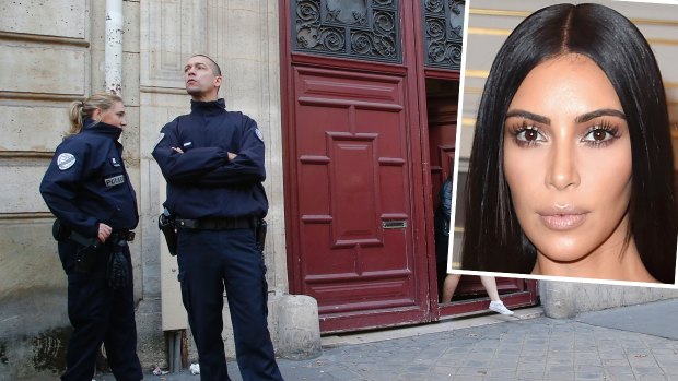 French police officers stand outside the residence of Kim Kardashian West in Paris.