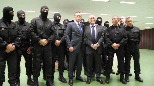 Tony Abbott poses with members of the French counter-terrorism unit.