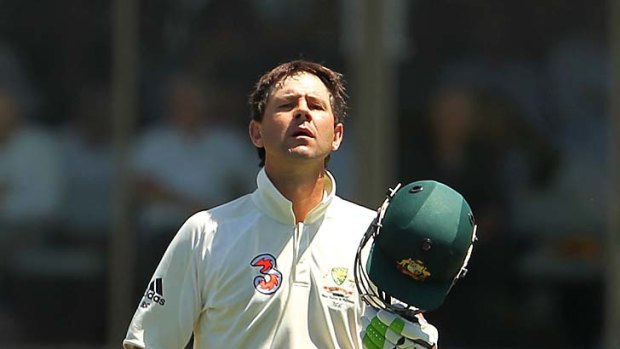 Ricky Ponting takes off his helmet after reaching his double century against Pakistan in Hobart on January 15, 2010.
