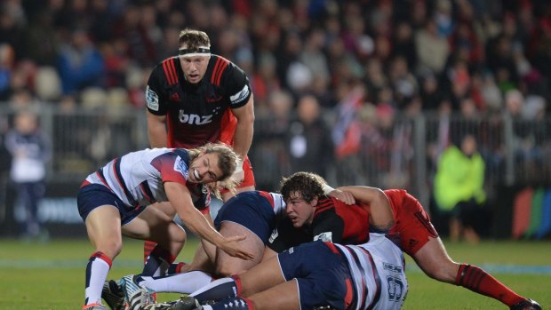 Weak resistance: Ben Meehan tries to get the ball during the Rebels' poor performance against the Crusaders in Christchurch.