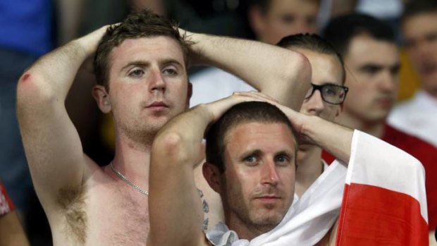 England fans react to their loss against Italy after their Euro 2012 quarter-final soccer match.