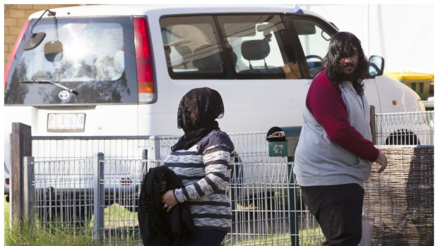 Family members leave the home in Perth Street, West  Heidelberg on Wednesday morning.