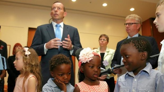 Jemima Dombkins, Charlie Dombkins, Shay Dombkins and Jabari Dombkins listen as Prime Minister Tony Abbott delivers his remarks at a morning tea.