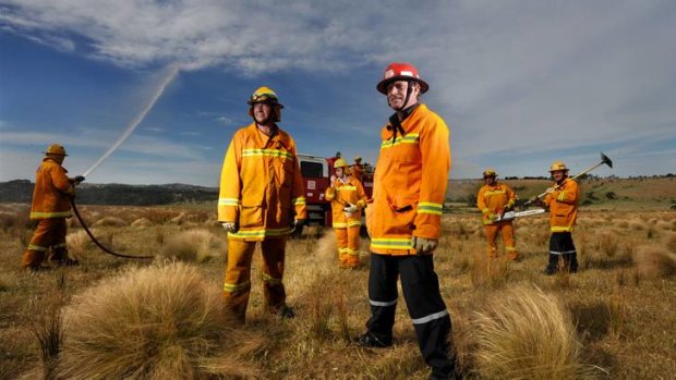 Officers Shane Trewin (front left) and Tony Ford and firefighters from Sunbury CFA prepare for the fire season.