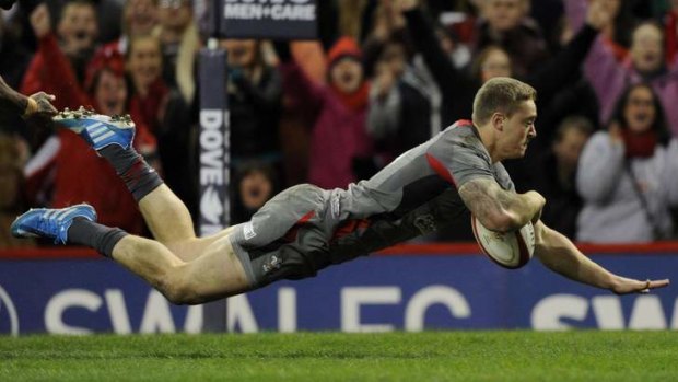 Owen Williams crosses the line for Wales against Tonga.