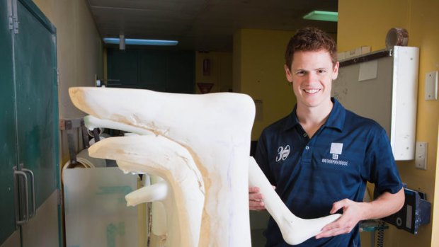 Brisbane Lions Rookie Steve Wrigley working with prosthetics at the Mater Hospital.