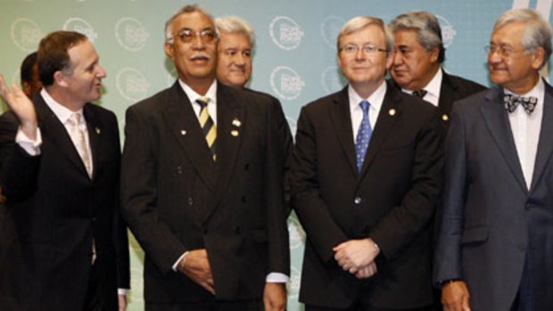 Suited up . .  . Mr Rudd poses with other leaders at the Pacific Forum in Cairns yesterday.