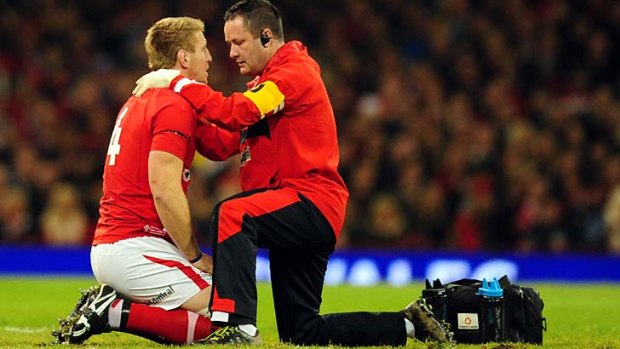 Bradley Davies recieves treatment on the field before heading to hospital.