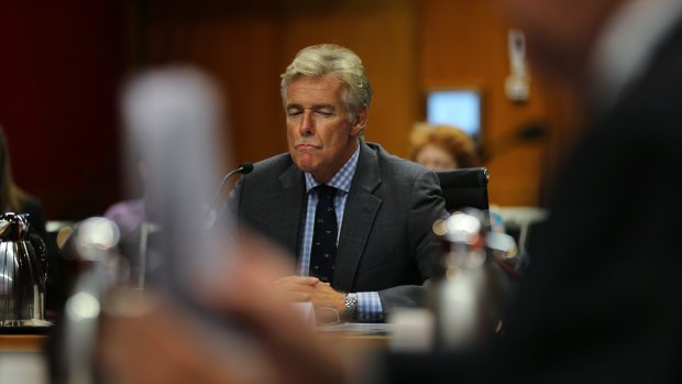 Former MP Tim Owen answers questions at the NSW Parliament inquiry into Newcastle corruption.