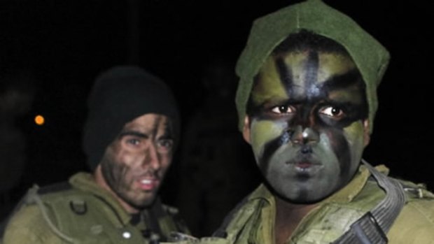 Israeli soldiers on the Israel-Gaza border before deploying into the Gaza Strip.