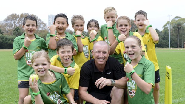 Enjoying retirement: Brad Haddin has a laugh with some junior cricketers.