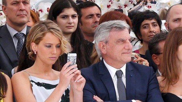 Face of Miss Dior handbags Jennifer Lawrence and Christian Dior CEO Sidney Toledano front row at the most recent Dior haute couture show in Paris.