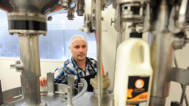Troy Peterken at work in his bottling plant. 'The inspector told us it was one of the cleanest and neatest dairy processing factories he had ever seen,' he says.