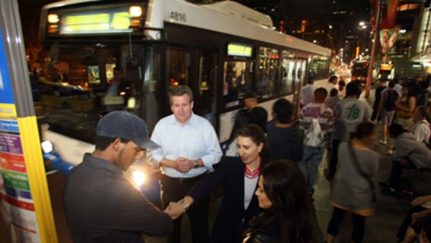 Take a ticket...Opposition leader Barry O'Farrell and transport spokeswoman Gladys Berejiklian on George Street at midnight trying to catch a bus