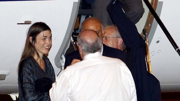 Happy ... Australian lawyer Melinda Taylor, left,  arrives at the airport in Rome.