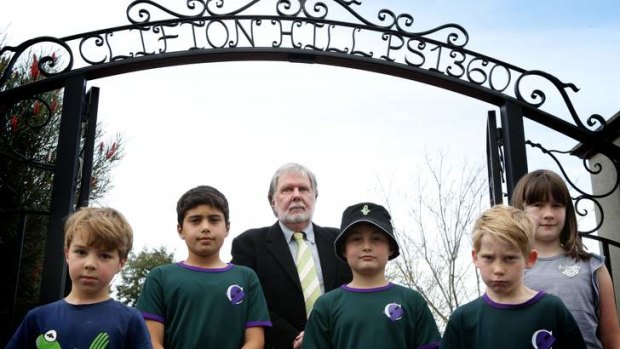 Clifton Hill Primary School principal Geoffrey Warren with some students unhapy about proposed east-west tunnel.