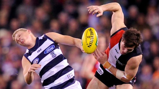 St.Kilda's Lenny Hayes colides with Geelong's Taylor Hunt.
