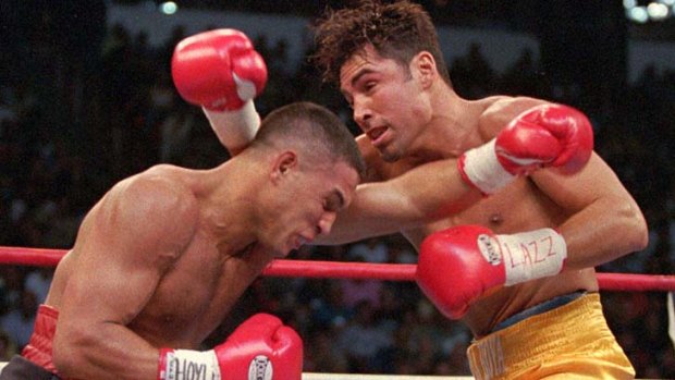 Ring great: Hector Camacho (left) takes on Oscar De La Hoya in 1997.