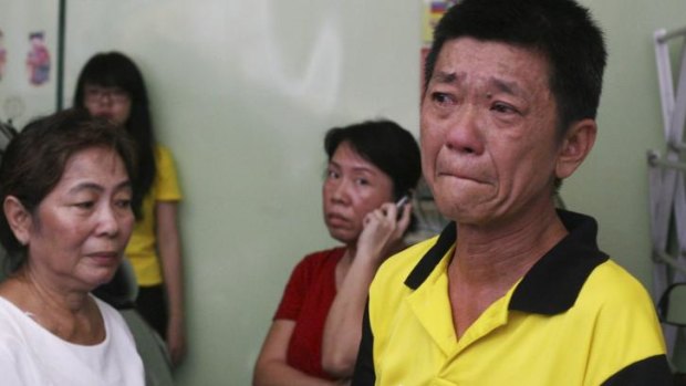 A relative of an Indonesian aboard MH17 cries in North Sumatra.