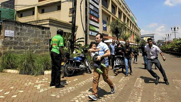 Unrest: customers run following a shoot-out between armed men and the police at the Westgate shopping mall in Nairobi.