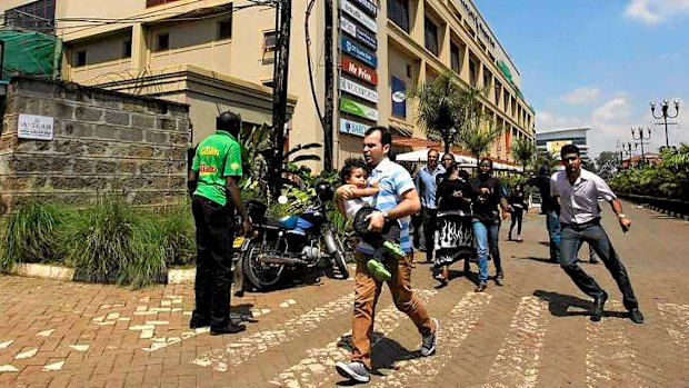 Unrest: customers run following a shoot-out between armed men and the police at the Westgate shopping mall in Nairobi.