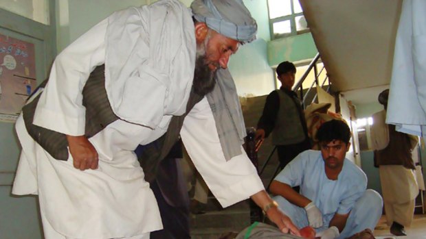 A victim of the airstrike  is treated by a doctor inside the main hospital in Kunduz.