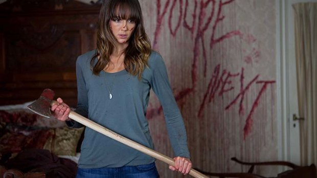 Film stills - You're Next. Starring: Sharni Vinson, Nicholas Tucci, Barbara Crampton. Icon Film Distribution, Directed by Adam Wingard. Supplied