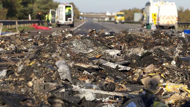 Debris on the motorway in the wake of the pile-up, where some cars were literally burnt to the ground.