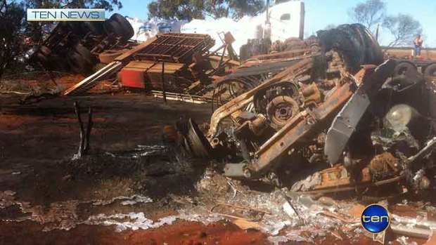 The triple road train after it collided with a utility, killing two men.