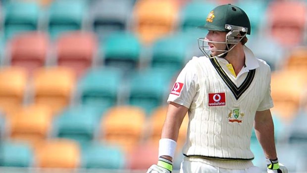 Phillip Hughes looks back as he walks off after being dismissed cheaply again.