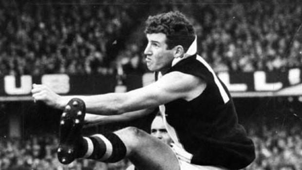 Kevin Neale kicks one of his five goals in the 1966 grand final.