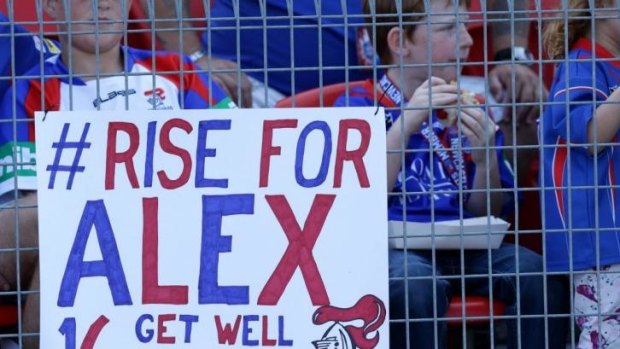 Fans show their support for stricken Newcastle player Alex McKinnon.
