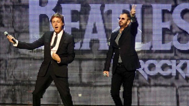 Paul McCartney and Ringo Starr at the launch of <i>The Beatles: Rock Band</i> game in June.