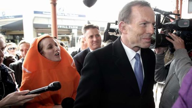 Clowning around: Koel Wrigley heckles Tony Abbott about the Great Barrier Reef.