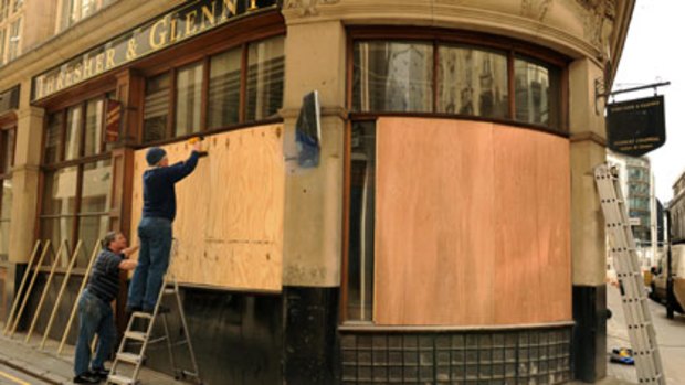 Ready for battle...a shop is boarded up near the Bank of England before expected G20 protests in London