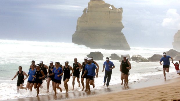 Rock on: The runners jog along the beach beside the Great Ocean Road.