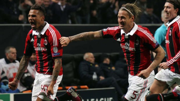 King ... AC Milan's Kevin-Prince Boateng (left) celebrates with teammate Philippe Mexes after scoring during their Champions League match against Barcelona.