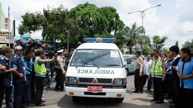 Ambulances carrying the bodies of Myuran Sukumaran and Andrew Chan arrive at the Abadi Funeral Homes in Daan Mogot, West Jakarta.