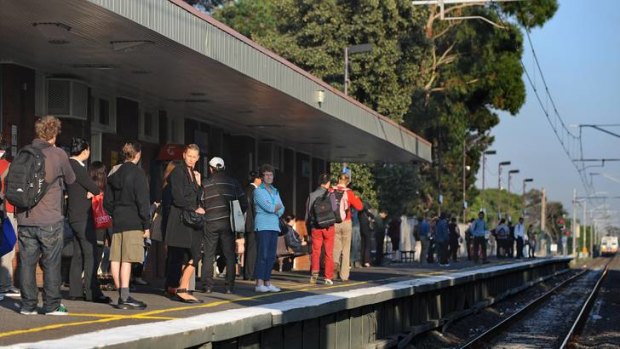 Driven loopy: Passengers await a train at Altona station.
