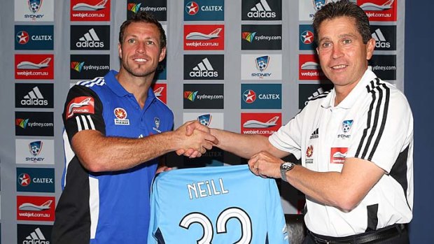 New signing Lucas Neill is presented with Sydney coach Frank Farina.
