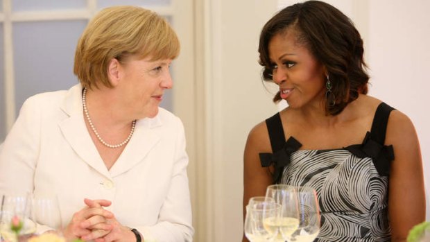 Friendly chat: German Chancellor Angela Merkel with US first lady Michelle Obama in Berlin.