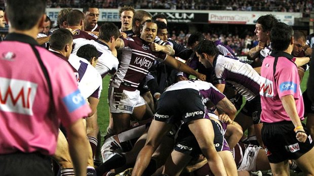 All in on the brawl: Sea Eagles and Storm players clash last night at Brookvale Oval. Manly won the main game 18-4.