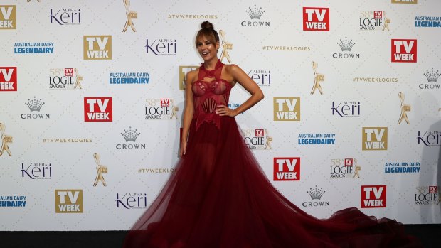 Lauren Phillips wearing a Con Ilio design with a long train, one of the trends on the Logies red carpet.