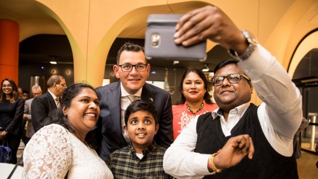 The Venkatachallam family pose with Premier Daniel Andrews after the premier addressed members of Melbourne's Indian community at Melbourne University.