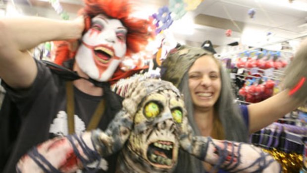 Halloween afficionados...Brad Coates and Esther Bailey buy ghoulish outfits.