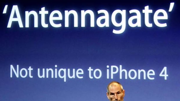 Apple CEO Steve Jobs appears on stage during a news conference at Apple headquarters in Cupertino, California, to address the issue of the iPhone 4's reception issues.